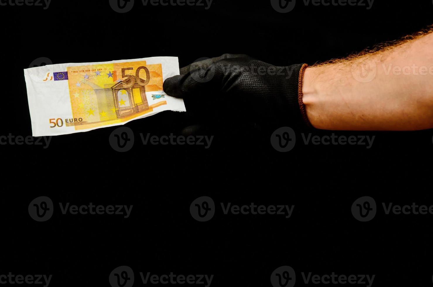 Hand holding cash bill photo