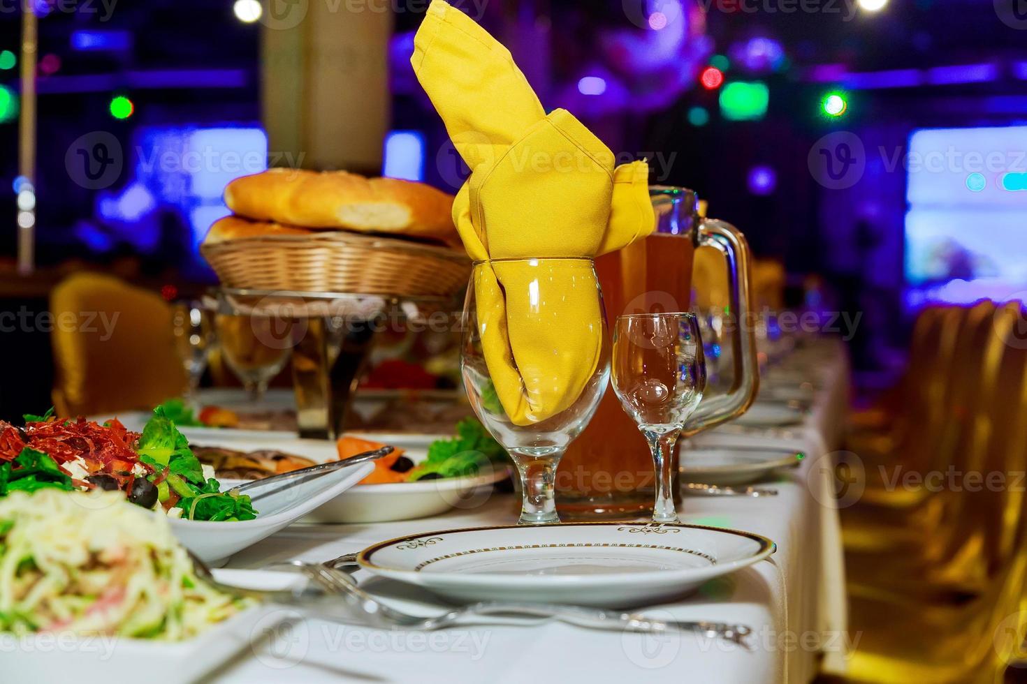 Beautifully decorated catering banquet table with different food snacks and appetizers photo