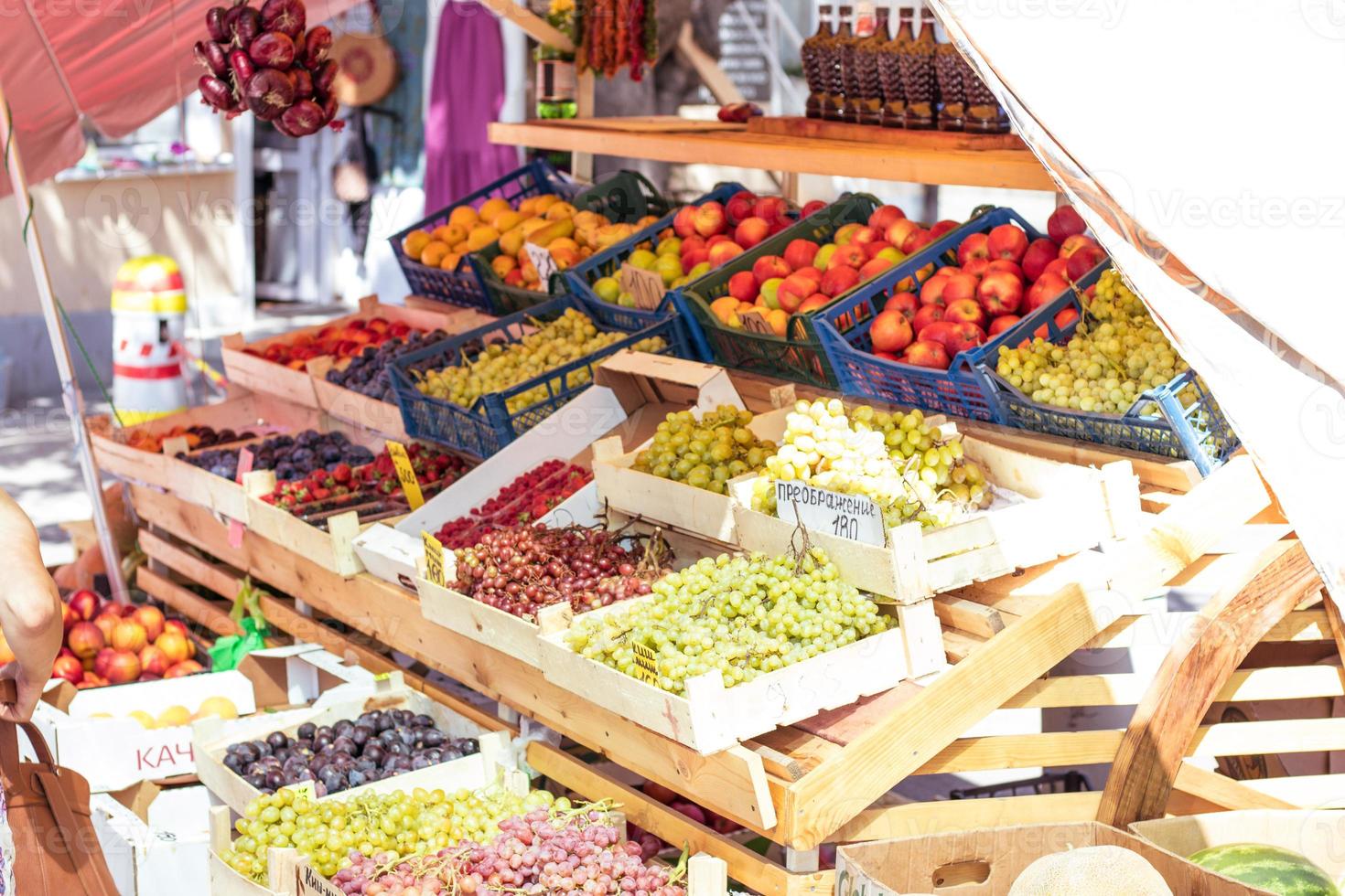 Market with fresh fruits and vegetables. Farm organic food tent photo