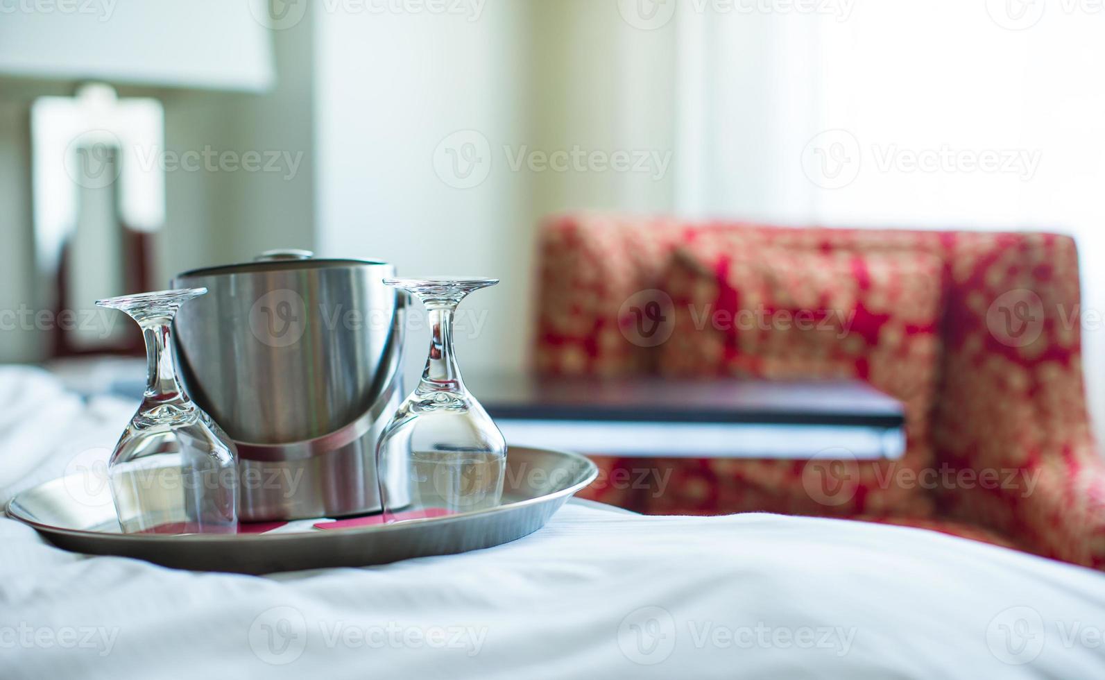 Glasses and metal bucket for couple in the bedroom for romantic night photo