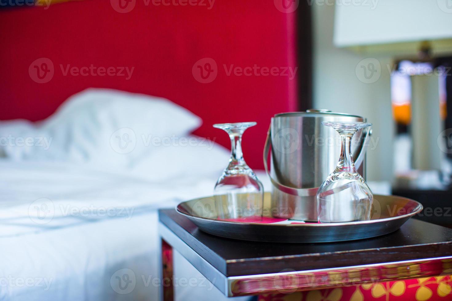 Glasses and metal bucket for couple in the bedroom for romantic night photo