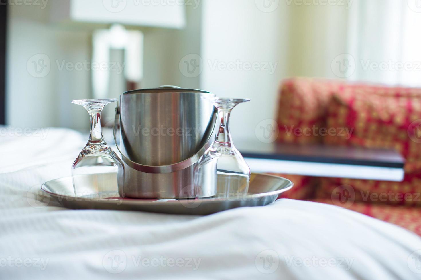 Glasses and metal bucket for couple in the bedroom for romantic night photo