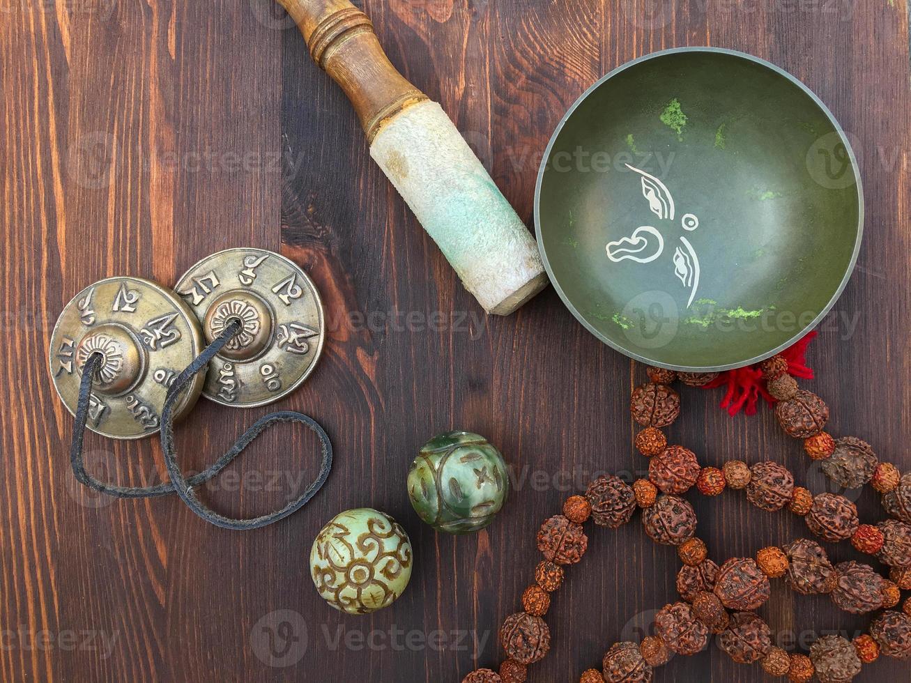 Tibetan singing bowl and objects for religious ritual photo