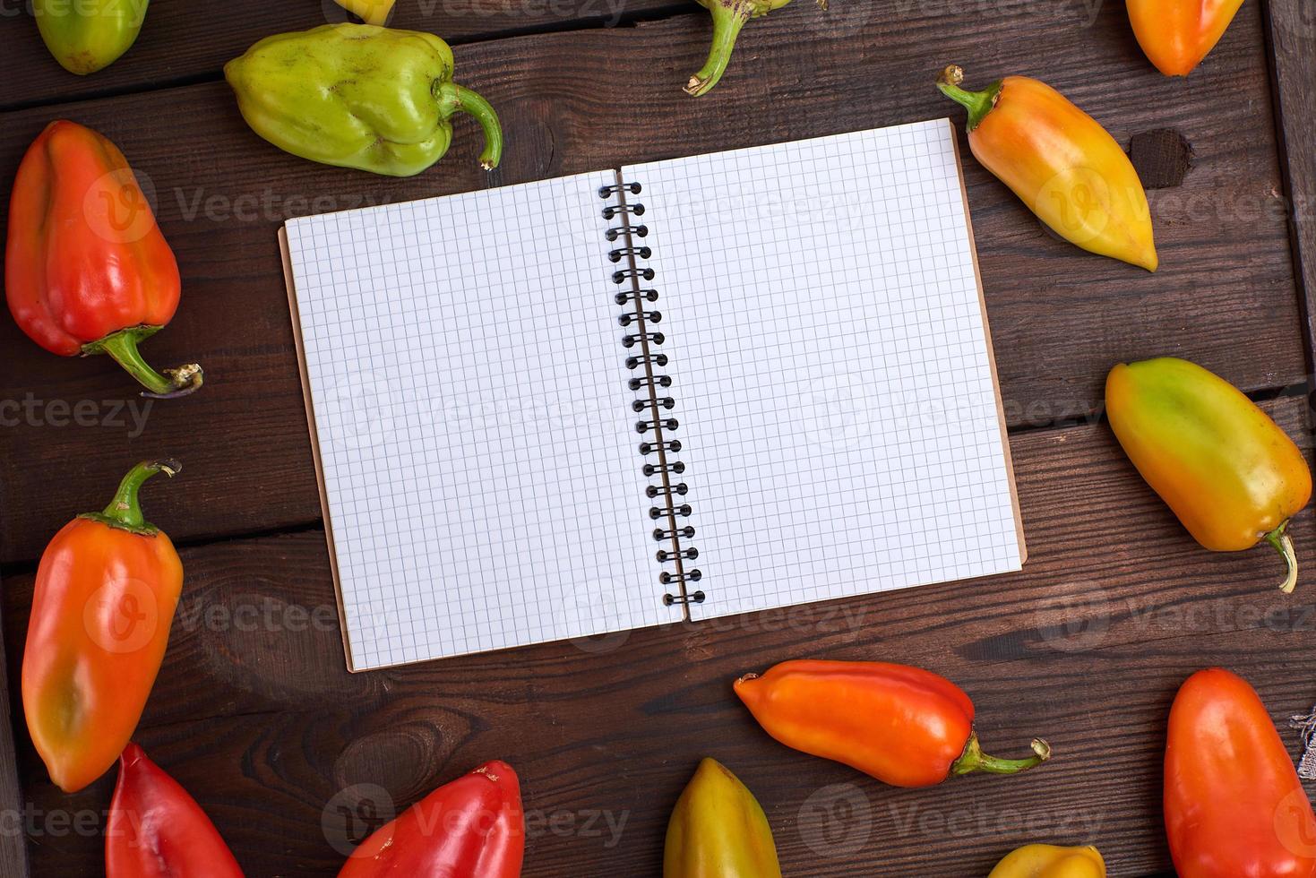 blank notepad on a brown table photo