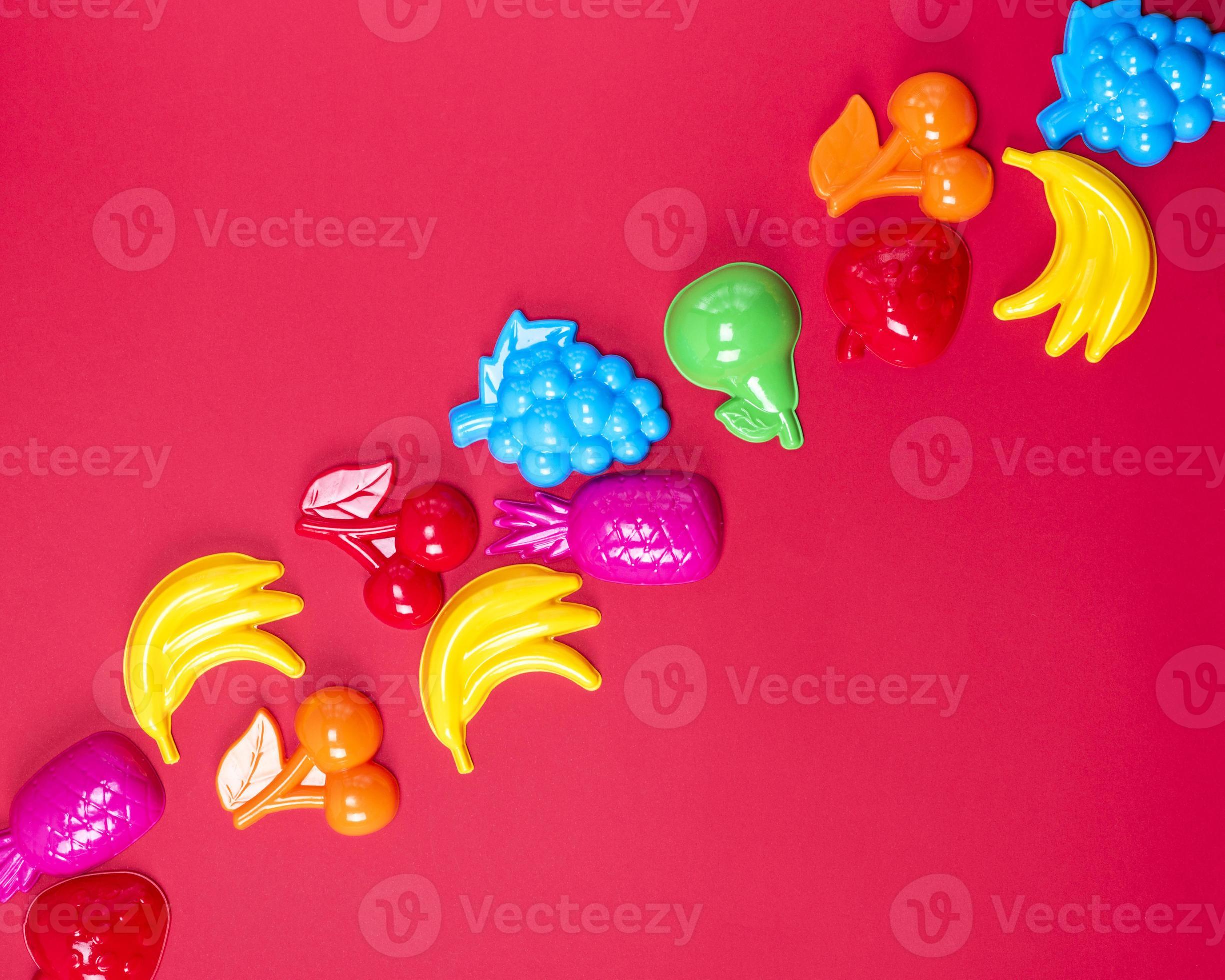 abstract red background with childrens plastic toys 19762472 Stock