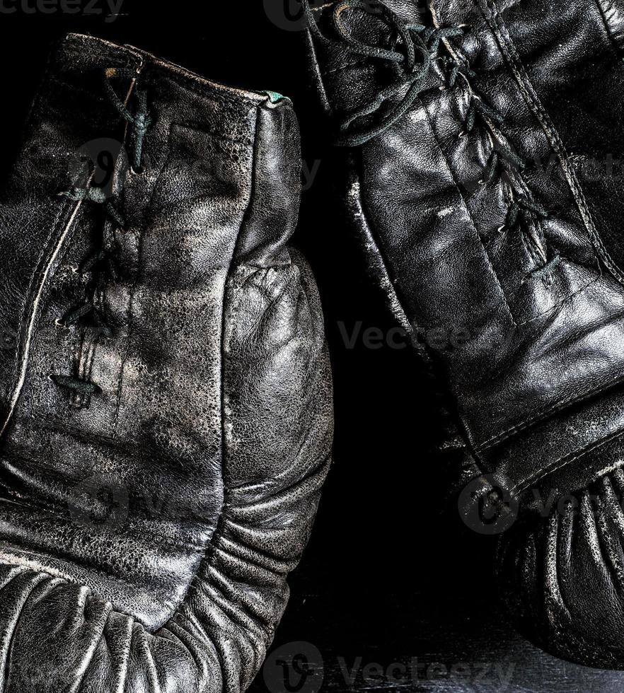 fragment of a pair of old leather boxing gloves photo