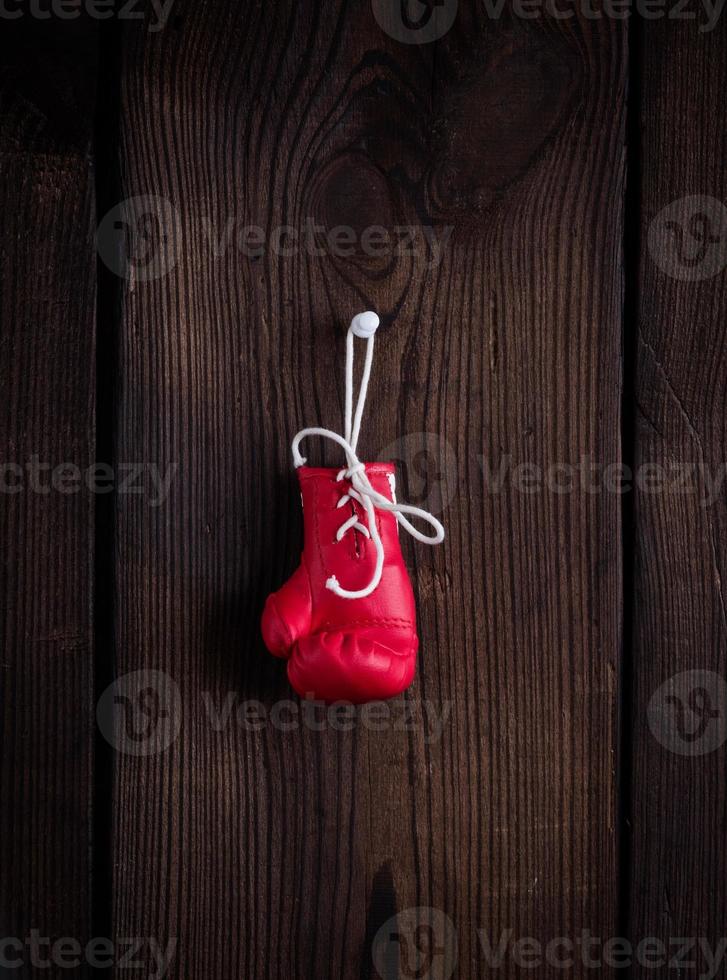 one leather red boxing glove with laces photo