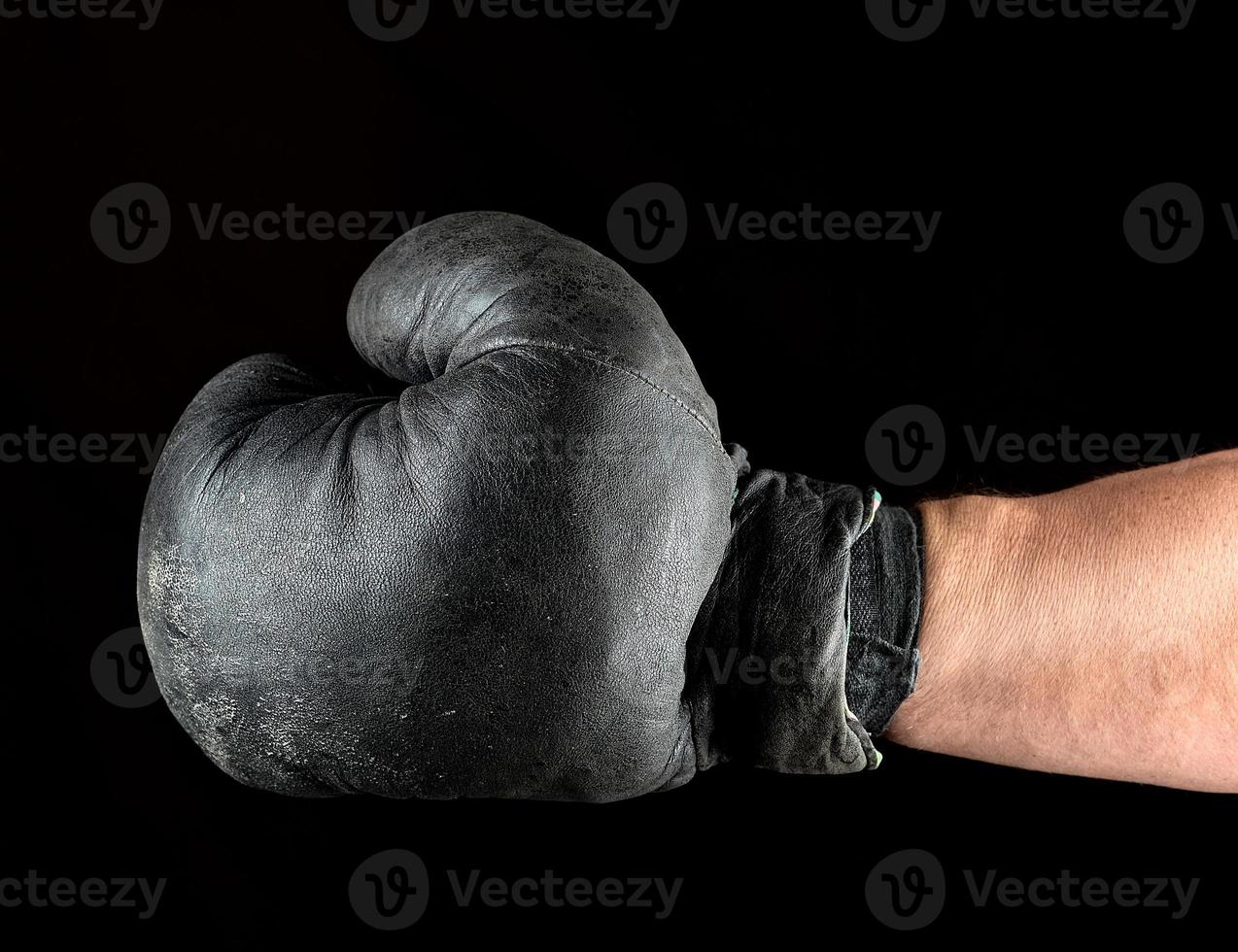 boxing glove dressed on man's hand photo