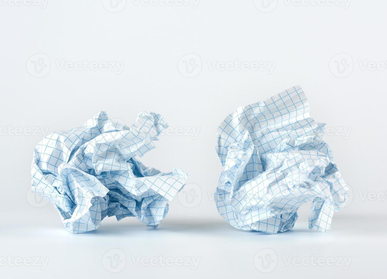 crumpled blank white sheet of paper into the cell from a school notebook photo