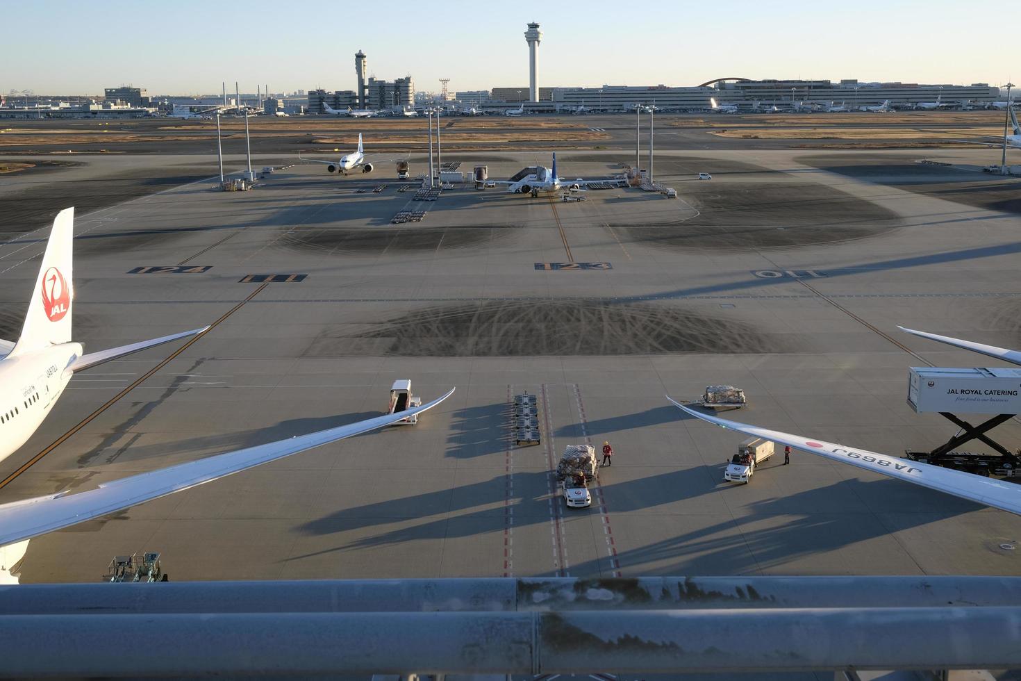 Tokyo, Japan - January 5, 2023 - Planes of Japan Airlines waiting for departure at Haneda airport in Tokyo, Japan. photo