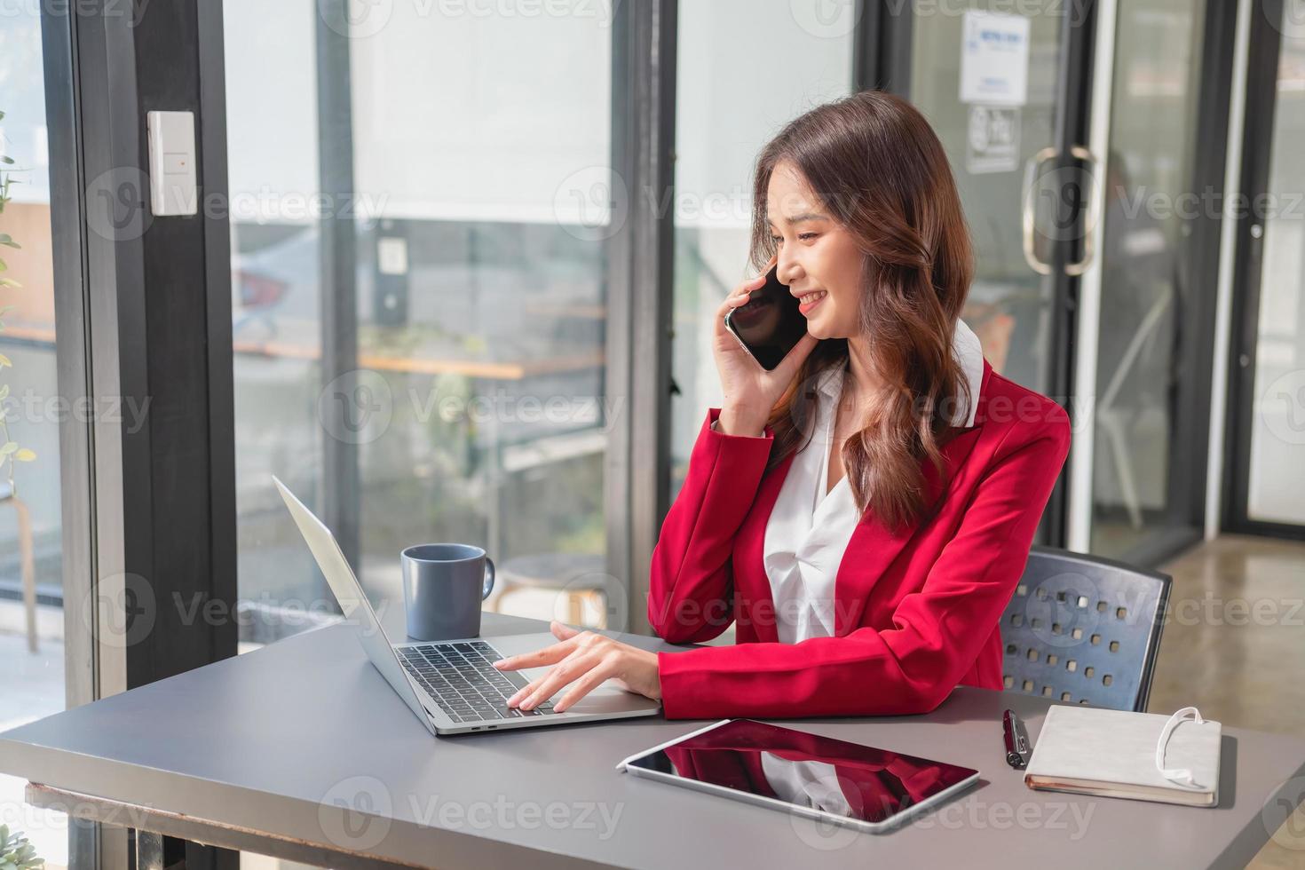 Marketing, Financial, Accounting, Planning, businesswoman uses a mobile phone to contact a customer to inform her of the company is business partnership. photo