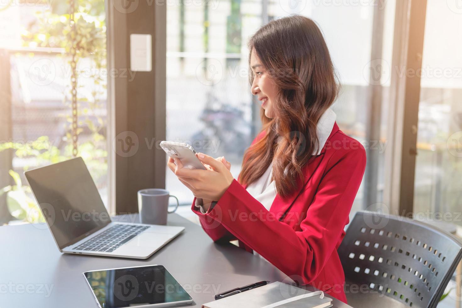 Marketing, Financial, Accounting, Planning, businesswoman uses a mobile phone to contact a customer to inform her of the company is business partnership. photo