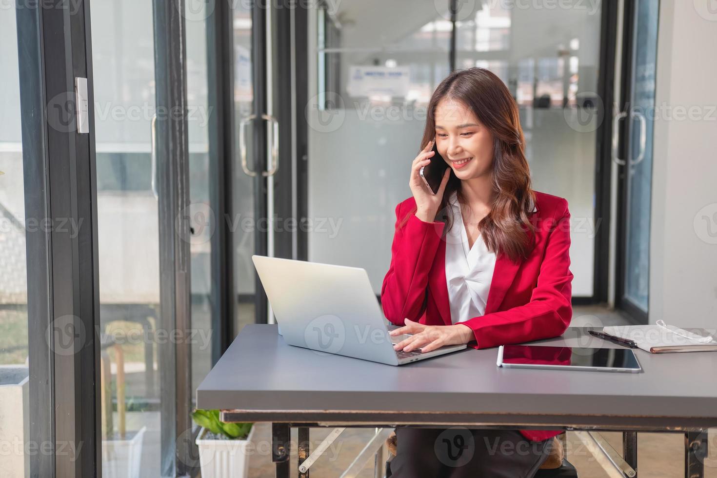 Marketing, Financial, Accounting, Planning, businesswoman uses a mobile phone to contact a customer to inform her of the company is business partnership. photo