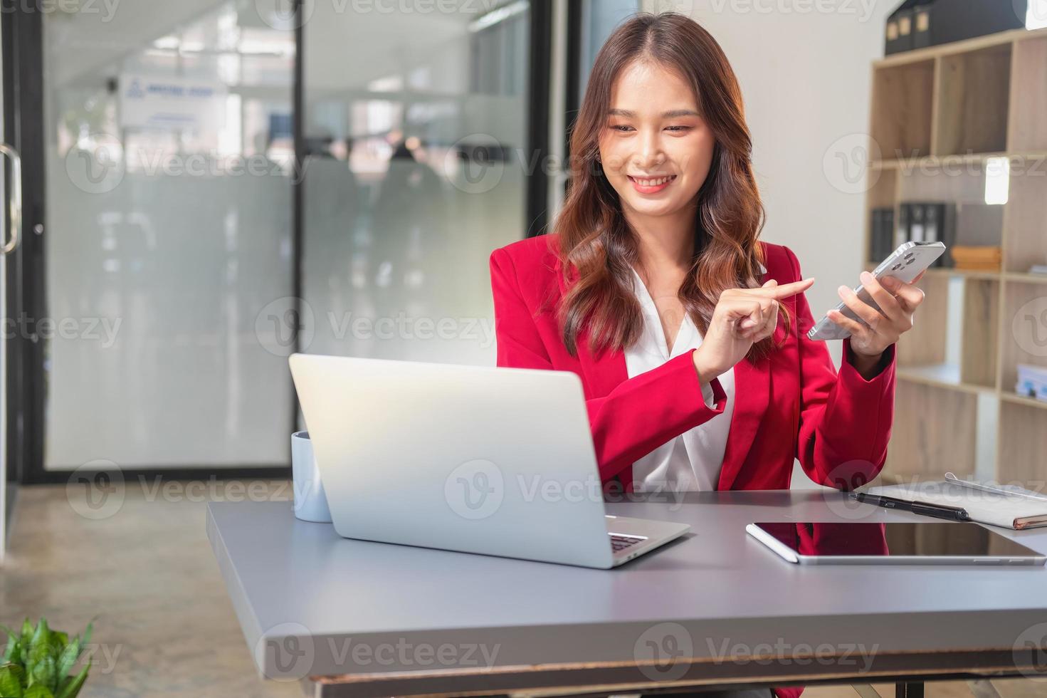 Marketing, Financial, Accounting, Planning, businesswoman uses a mobile phone to contact a customer to inform her of the company is business partnership. photo