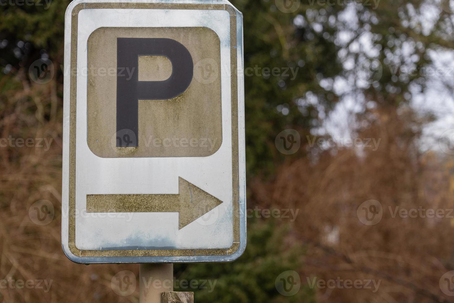 Close-up at parking sign in the public parking area photo