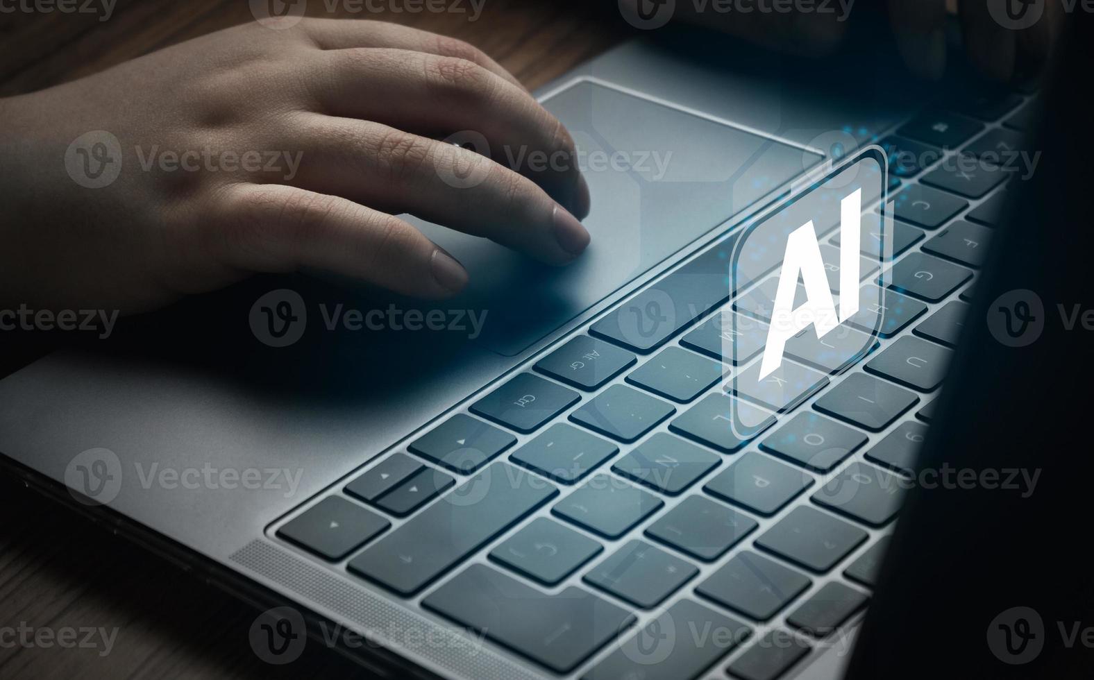 Woman using laptop with AI hologram interface. Concept of artificial intelligence use analytics, automation, and autonomous brain. photo