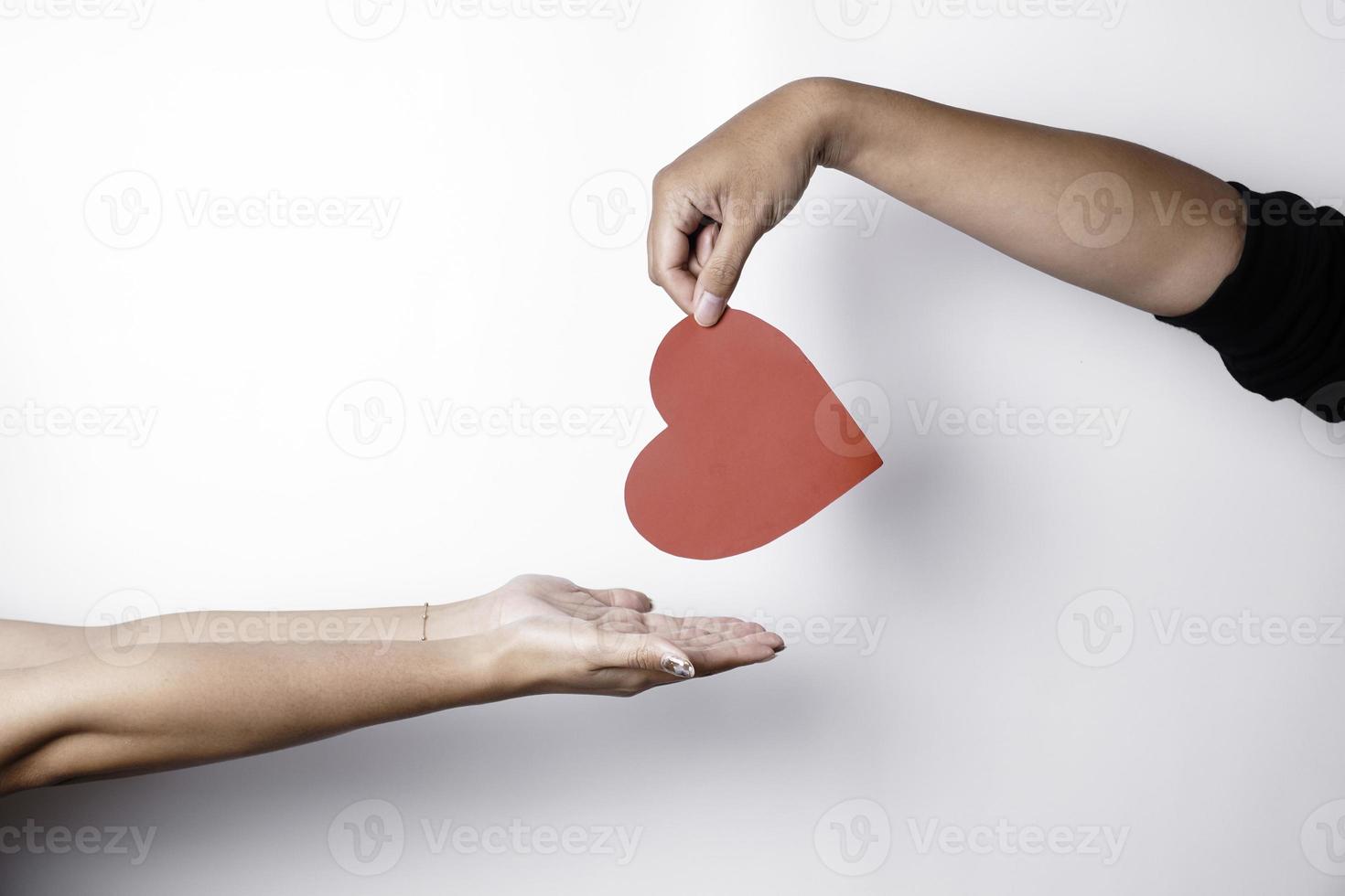 A photo of a red heart shape paper isolated on white background.