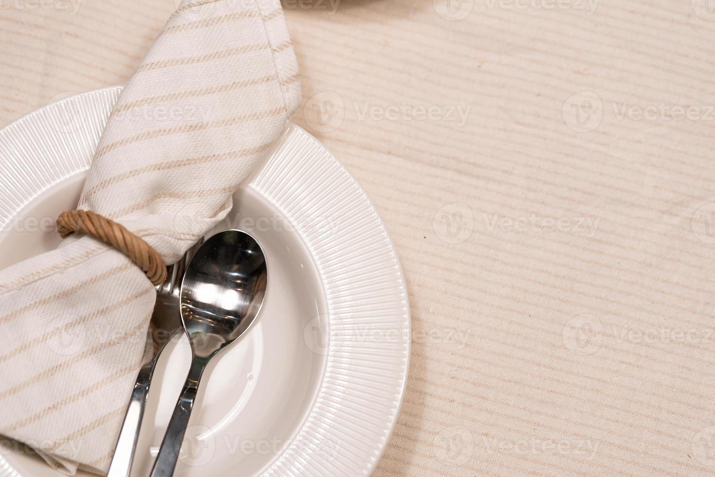 Empty plate, bowl and spoon on table. Top view with copy space. selective focus photo