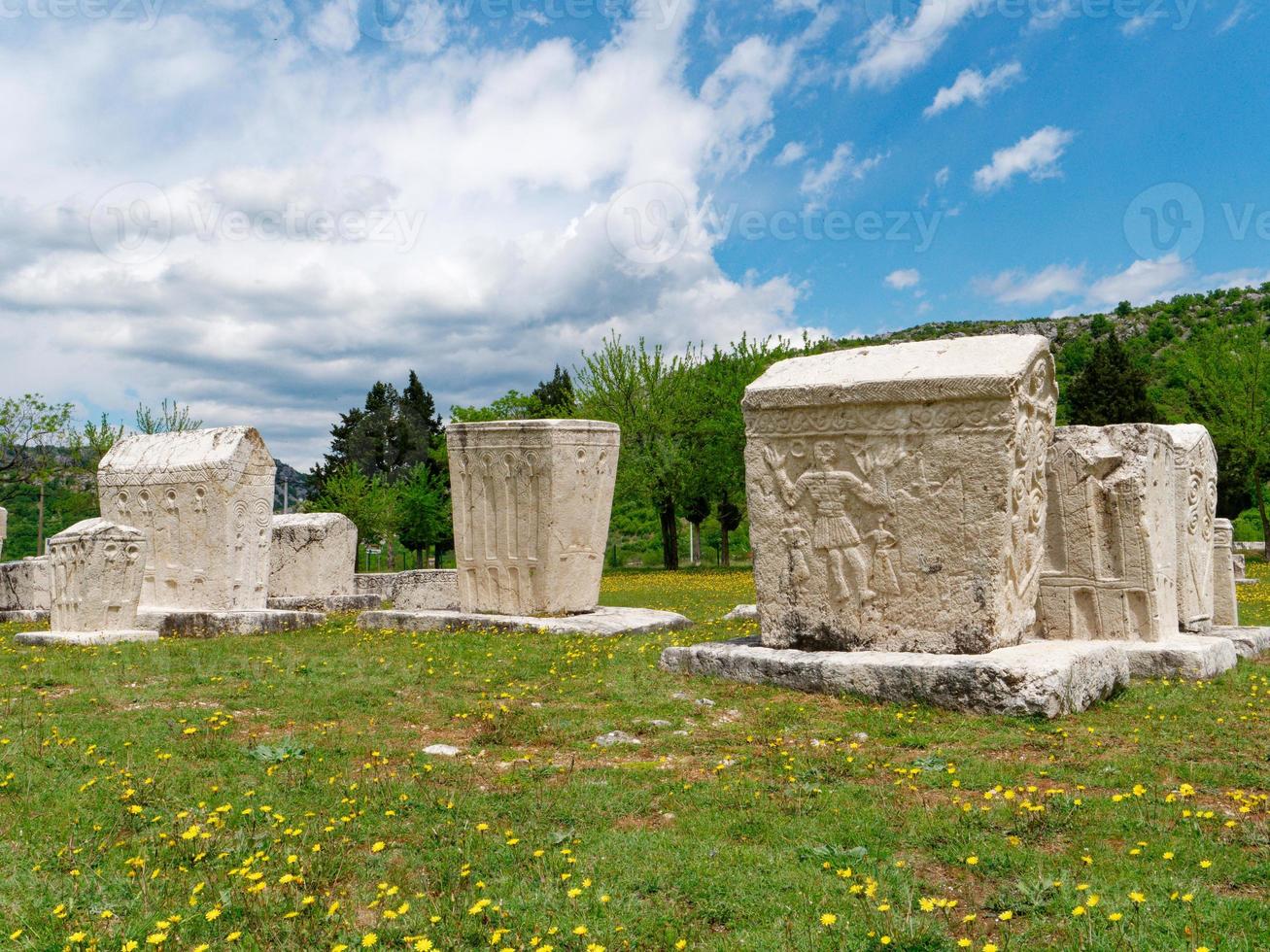 Stecci Medieval Tombstones Graveyards in Radimlja, Bosnia and Herzegovina. Unesco site. Historic place of interest. The tombstones feature a wide range of decorative motifs and inscriptions. photo