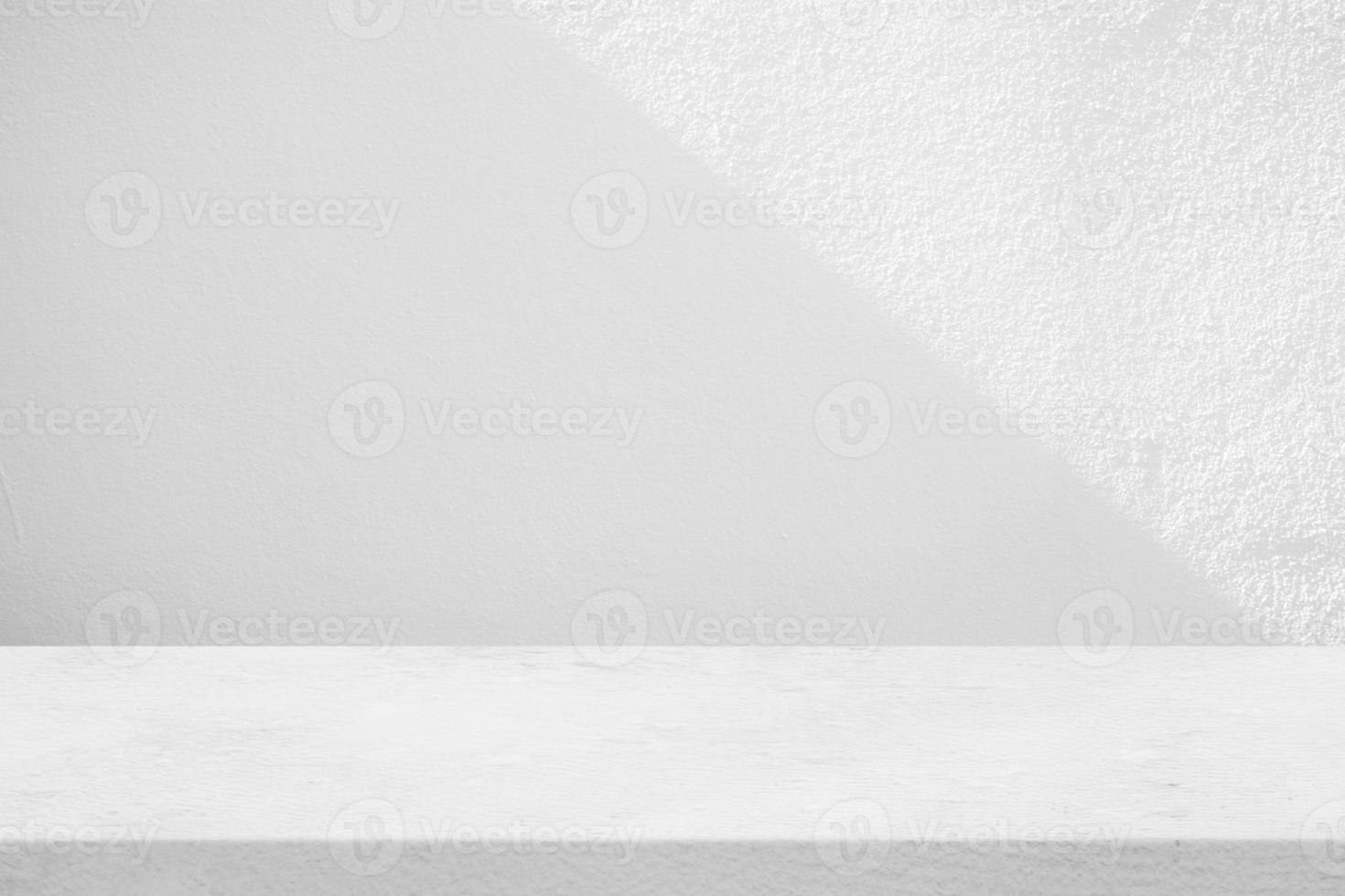Concrete Table with White Stucco Wall Texture Background with Light Beam and Shadow, Suitable for Product Presentation Backdrop, Display, and Mock up. photo