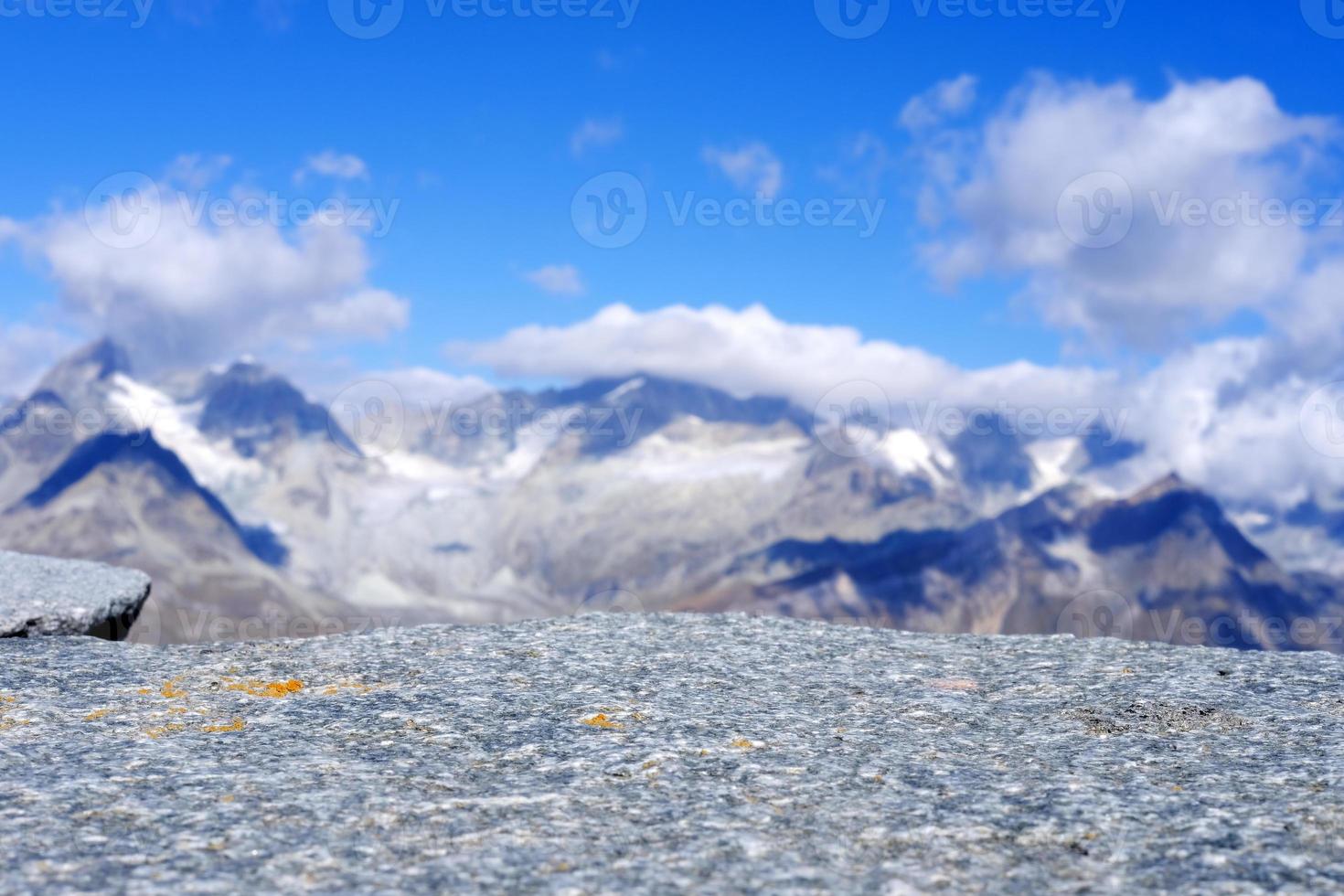 Stone Table Selective Focus at Surface with Blurred Snow Mountain at Gornergrat Cable Station Background, Suitable for Product Presentation Backdrop, Display, and Mock up. photo