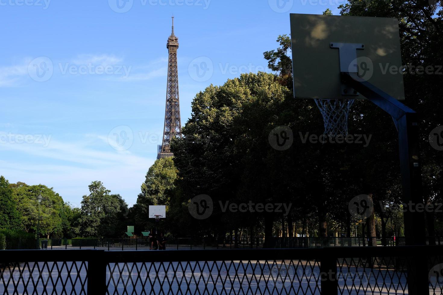Scenery of Eiffel Tower from The Champ de Mars Field of Mars where is a large public green space in Paris, France. photo