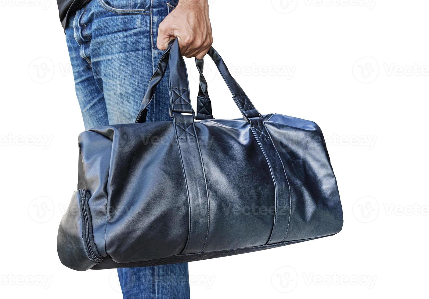 Man wearing jeans holding black leather bag isolated on white background with clipping path photo