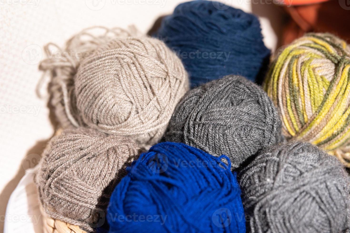 Balls of wool in various colors. close up view on wool knitting balls in different colors. photo