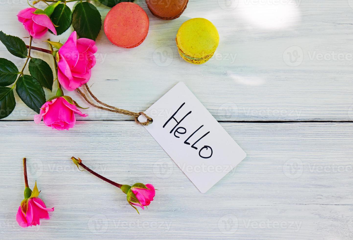 pink roses with inscription label and hello photo