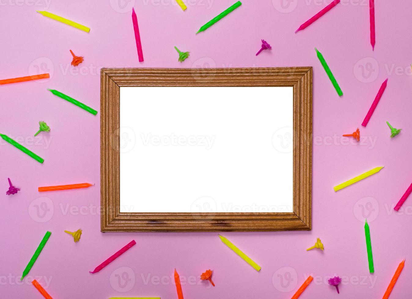 empty wooden frame on a pink background photo