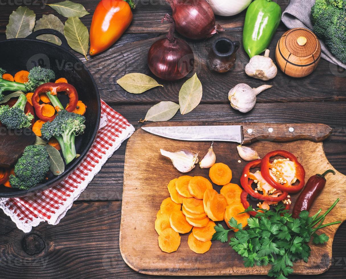 fresh pieces of broccoli, carrots and red peppers photo