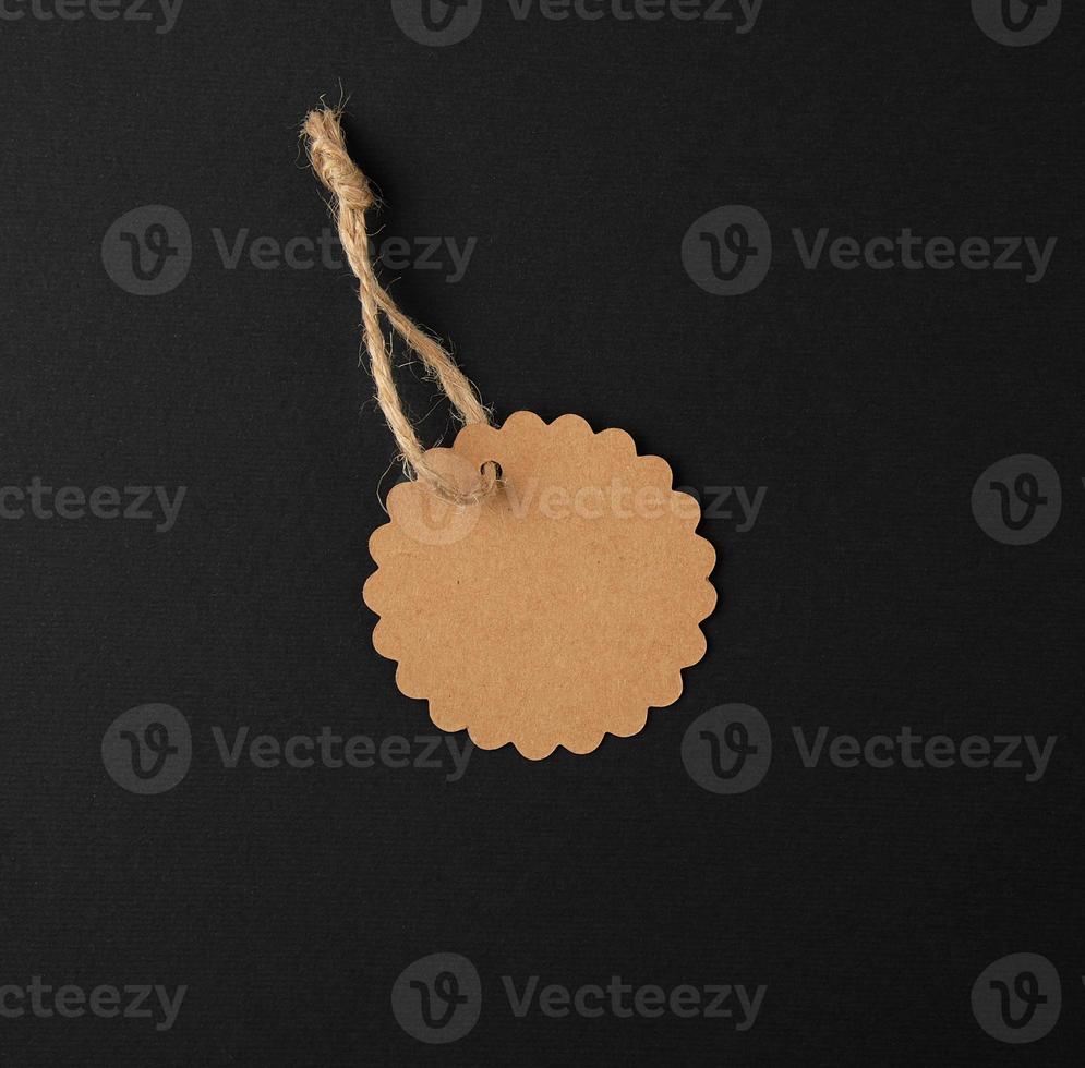 empty paper round brown tag on a rope photo