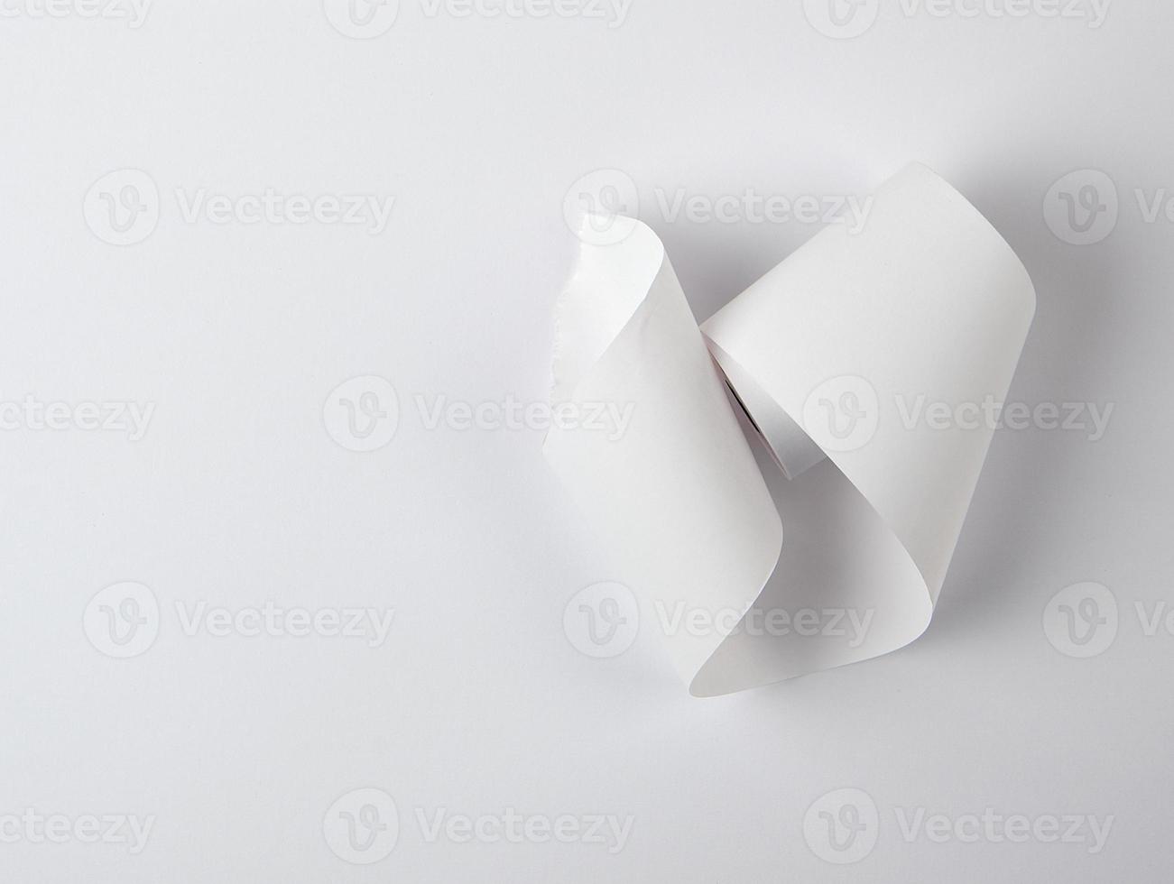 white piece of paper is twisted,  white background photo