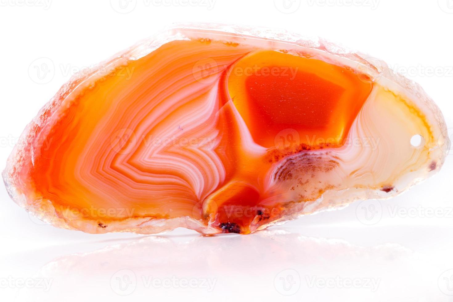Macro mineral orange agate in crystals on white background photo