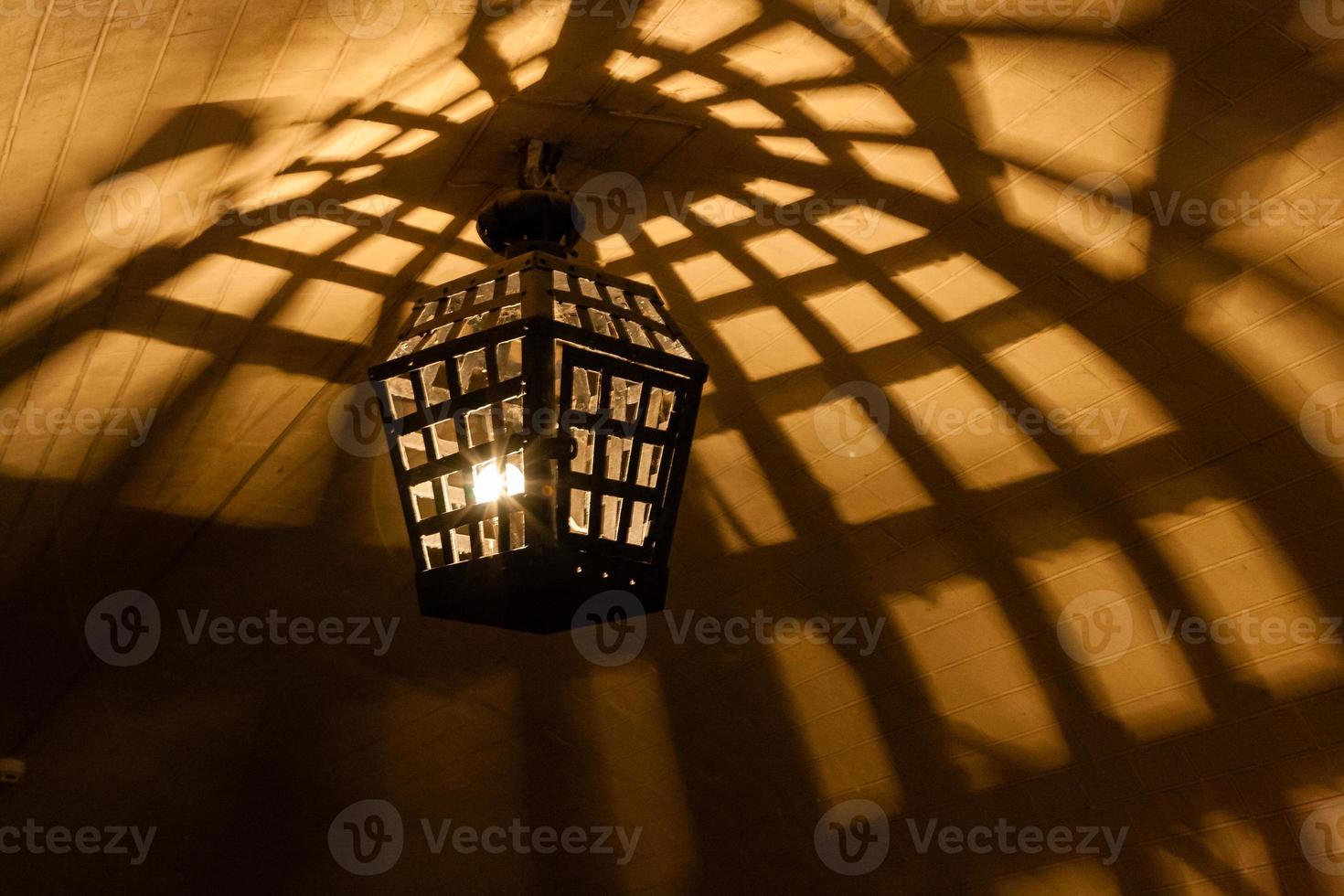 Antique lamps chandeliers in the cave dungeon photo