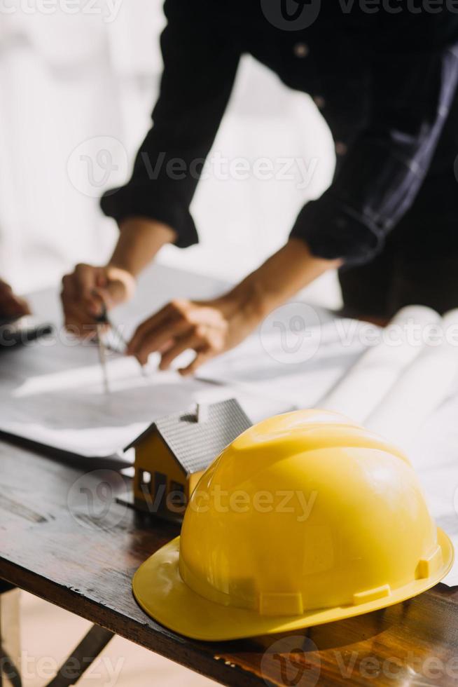 Architect concept, Architects working with blueprints in the office, Vintage Effect photo