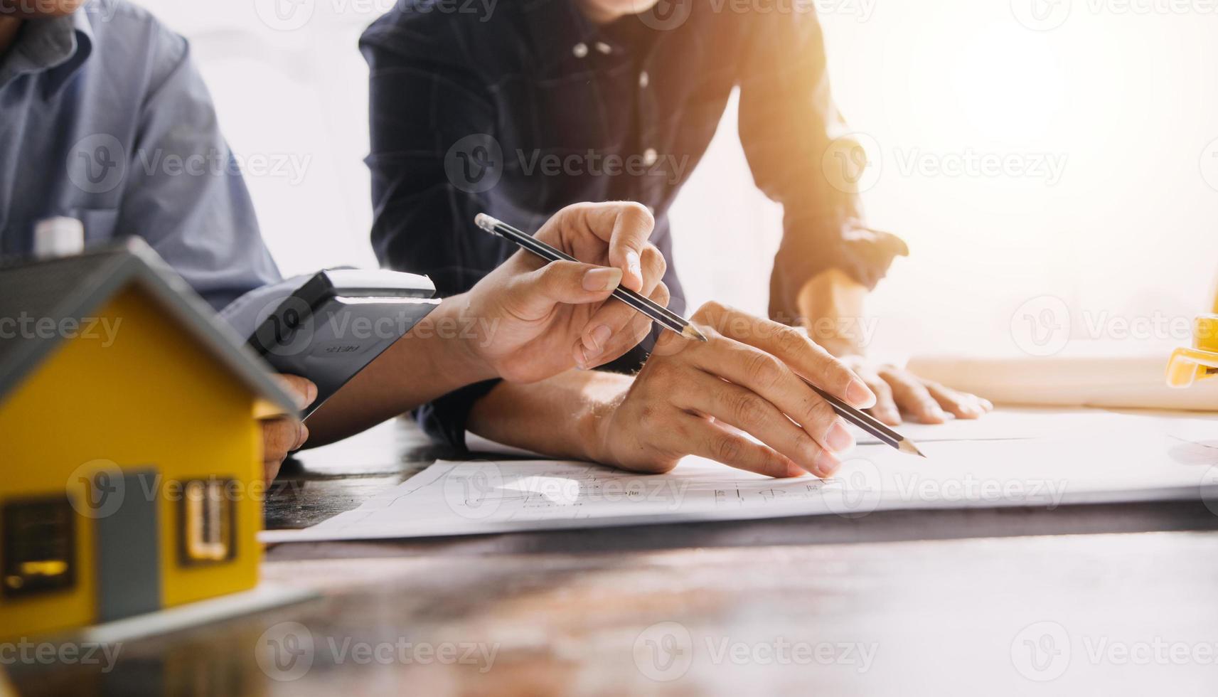 Architect concept, Architects working with blueprints in the office, Vintage Effect photo