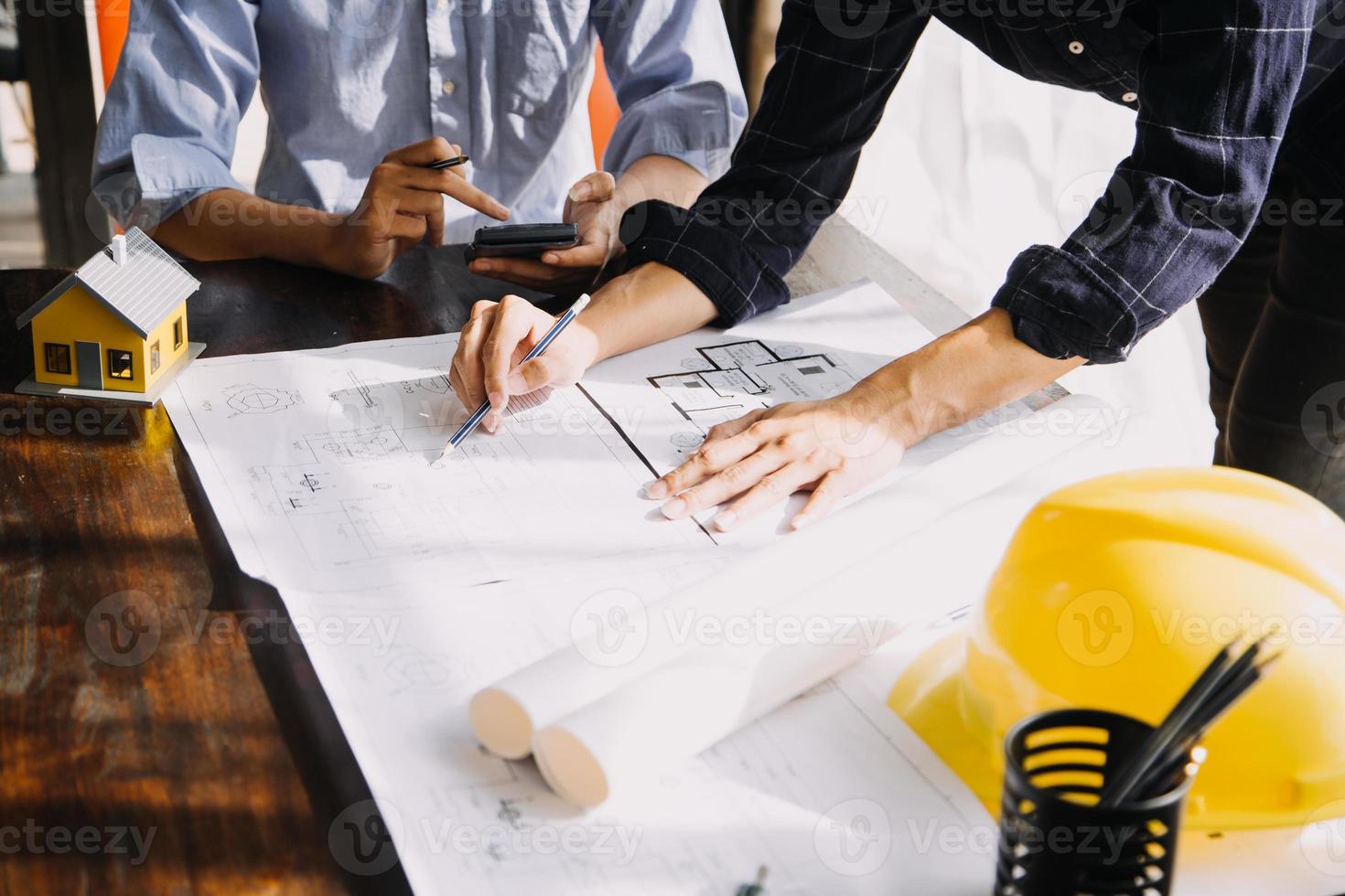 Architect concept, Architects working with blueprints in the office, Vintage Effect photo