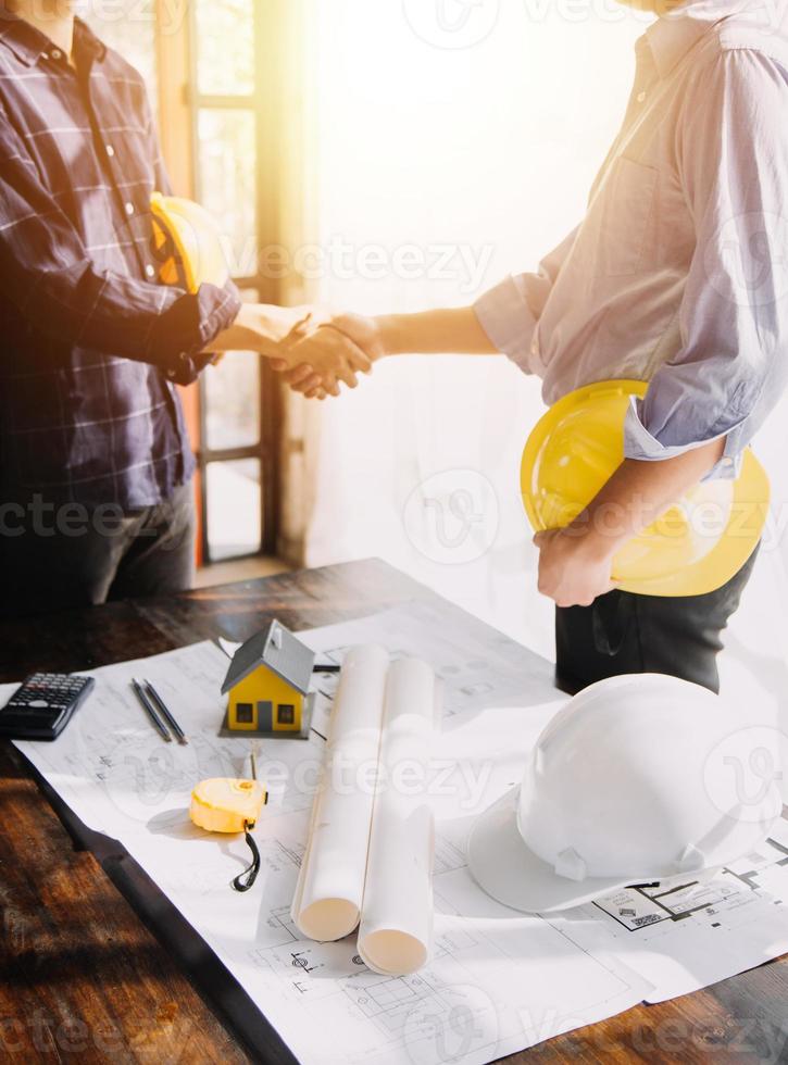 Architect concept, Architects working with blueprints in the office, Vintage Effect photo