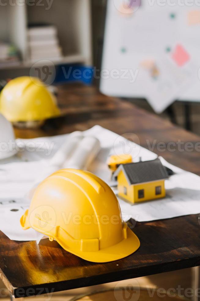 Architect concept, Architects working with blueprints in the office, Vintage Effect photo