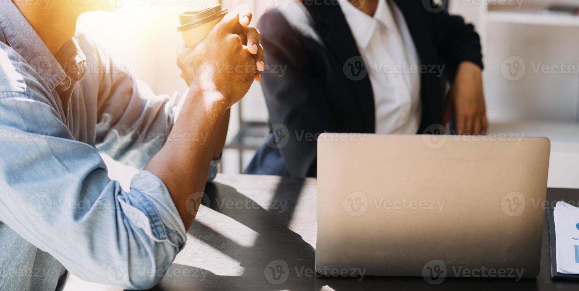 Asian Business woman using calculator and laptop for doing math finance on an office desk, tax, report, accounting, statistics, and analytical research concept photo