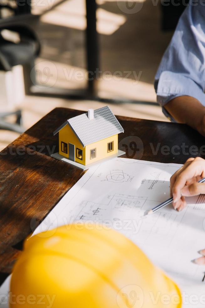 Architect concept, Architects working with blueprints in the office, Vintage Effect photo