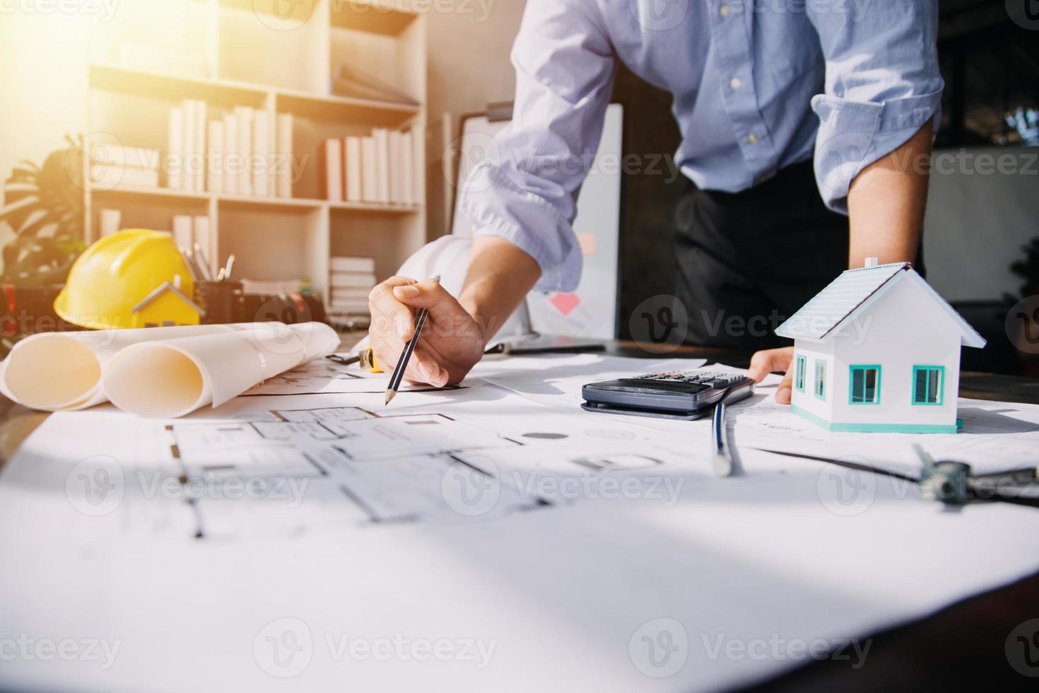 Architect concept, Architects working with blueprints in the office, Vintage Effect photo