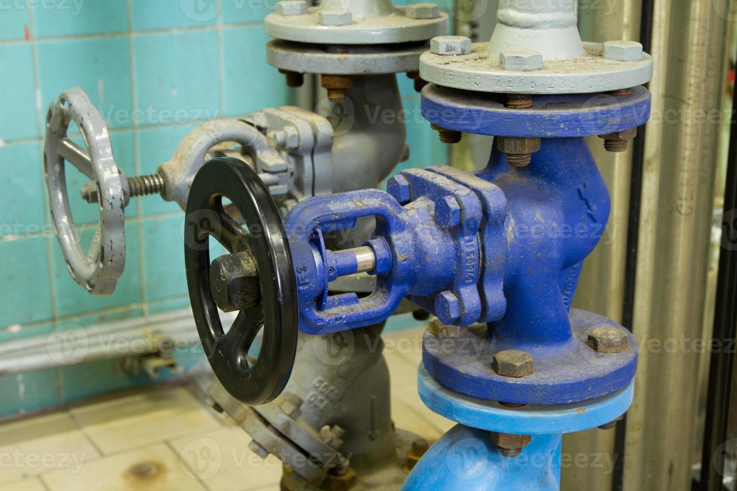 Pipes and faucet valves of heating system in a boiler room photo