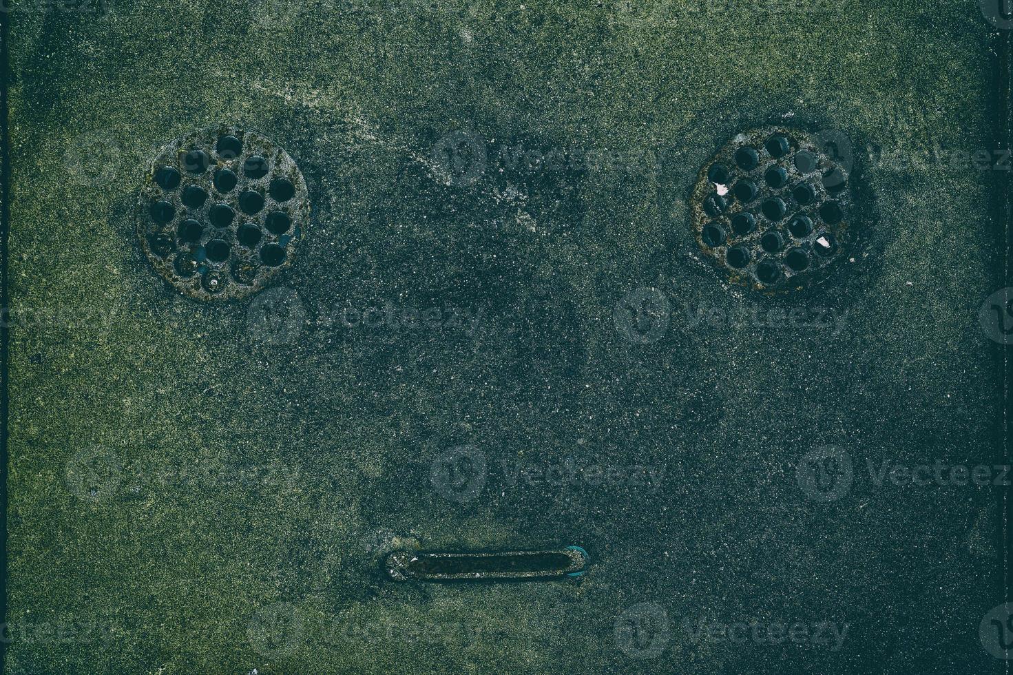 Close up Drainage Cover in Robot Face. photo