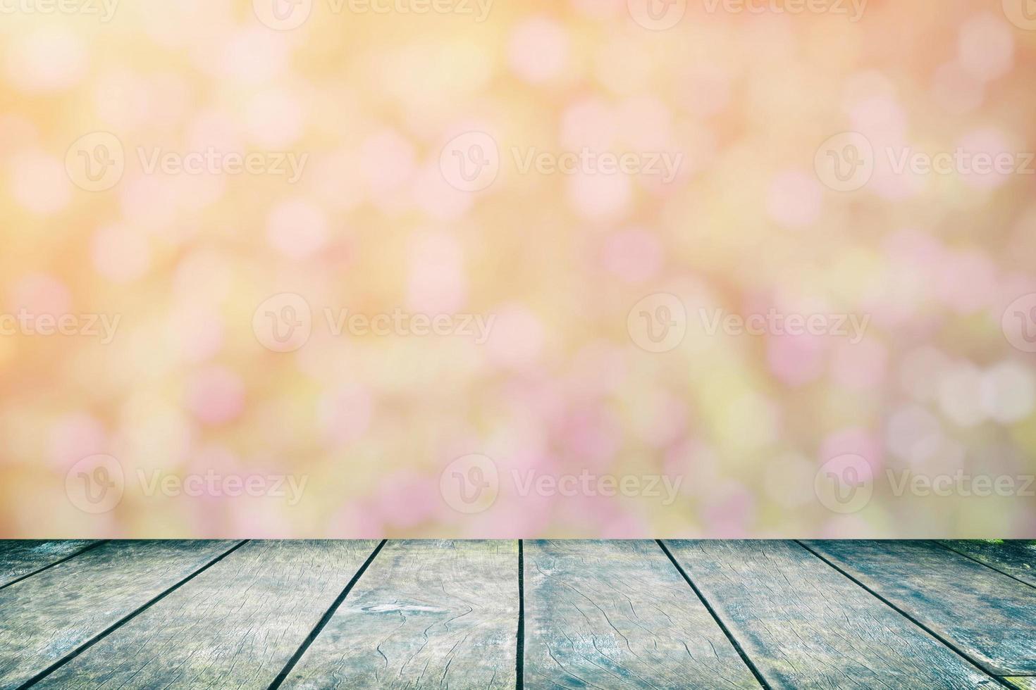 Wood Table with Blurred Tropical Garden with Beautiful Bokeh Background, Suitable for Product Display and Natural Concept. photo