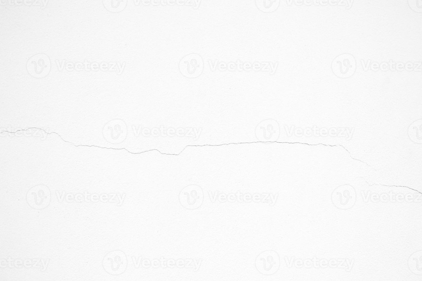 blanco agrietado roto hormigón pared textura antecedentes. foto