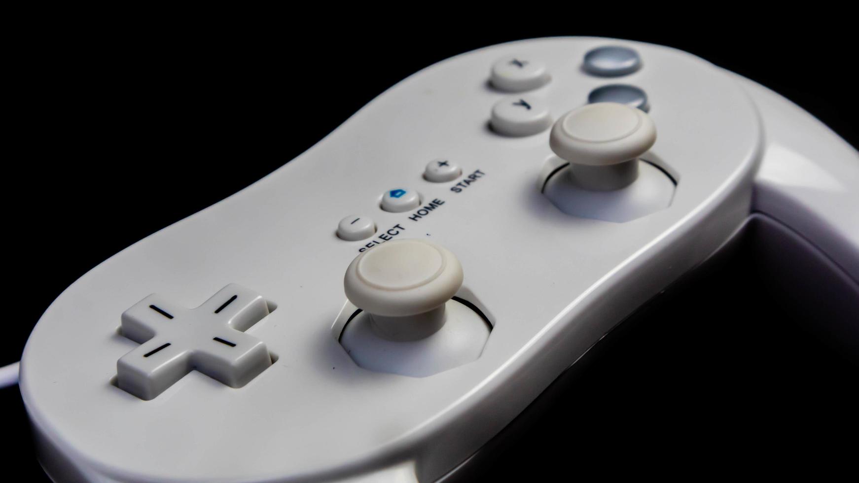 white joystick isolated black background photo