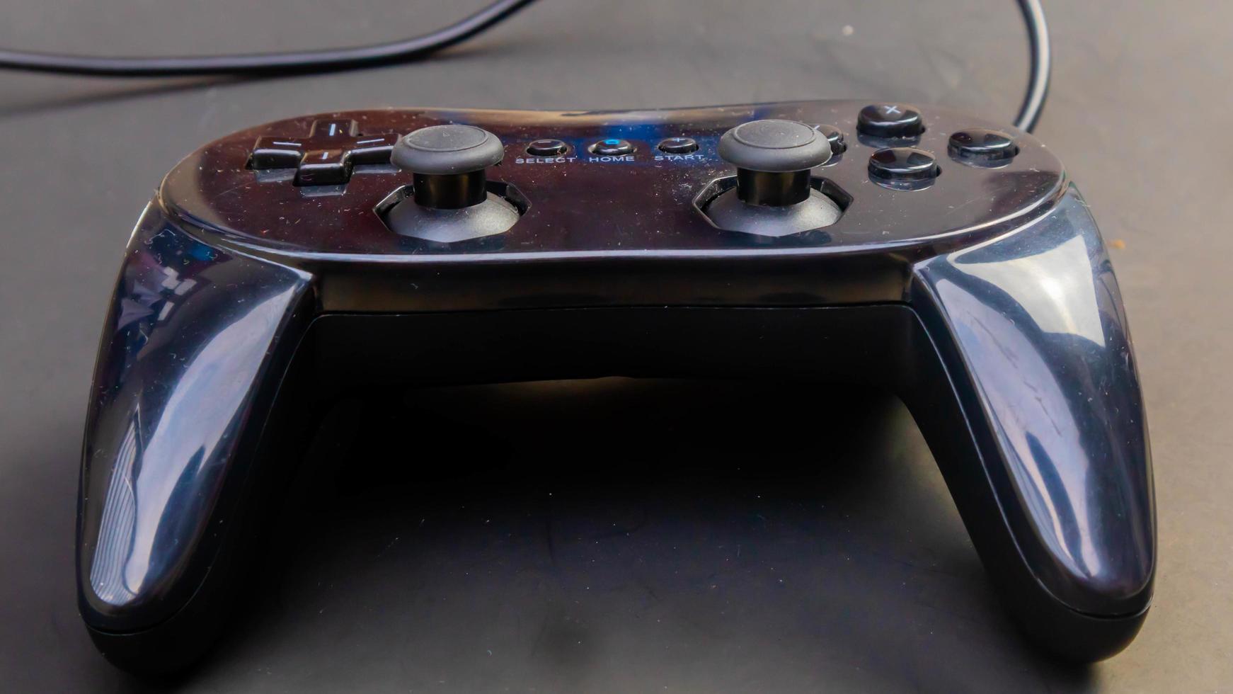 black joystick isolated black background photo