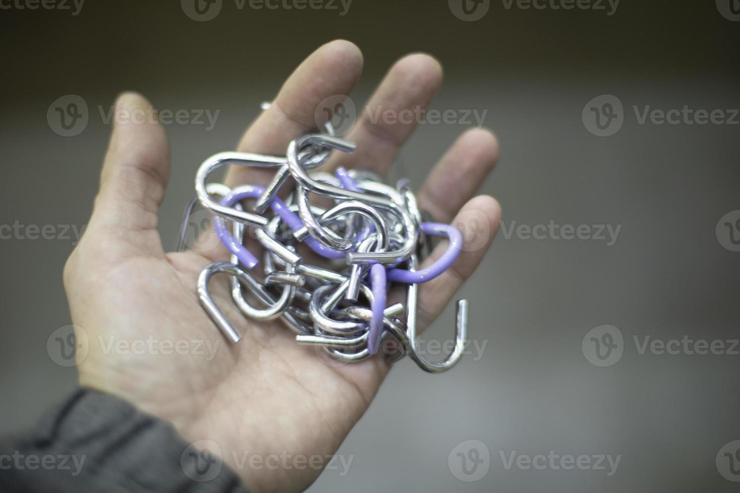 Chain in hand. Steel links. Lock in palm of your hand. photo